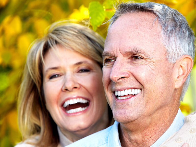 Smiling Couple With Implants From Bone Grafting