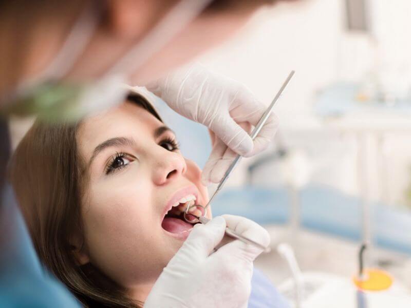 Woman having a dental checkup for gum receding