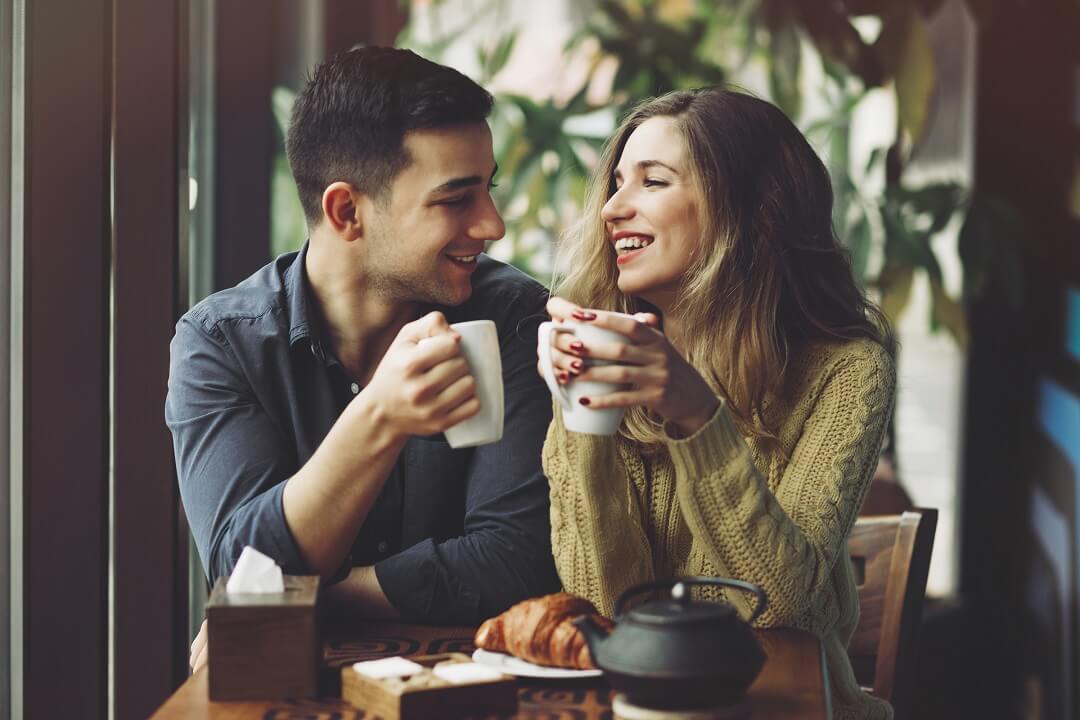 Couple drinking coffee in coffee shop in Edmonds